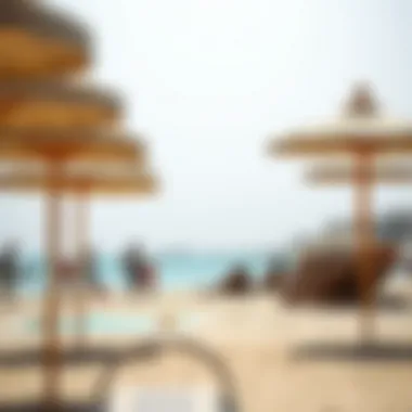 A vibrant beach scene with families enjoying recreational activities and visitors relaxing under beach umbrellas at Jumeirah Beach 2