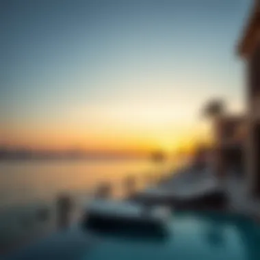 Stunning waterfront view of Maison Privée at sunset